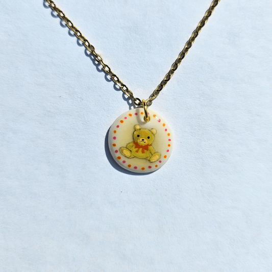 Ourson au ruban orange